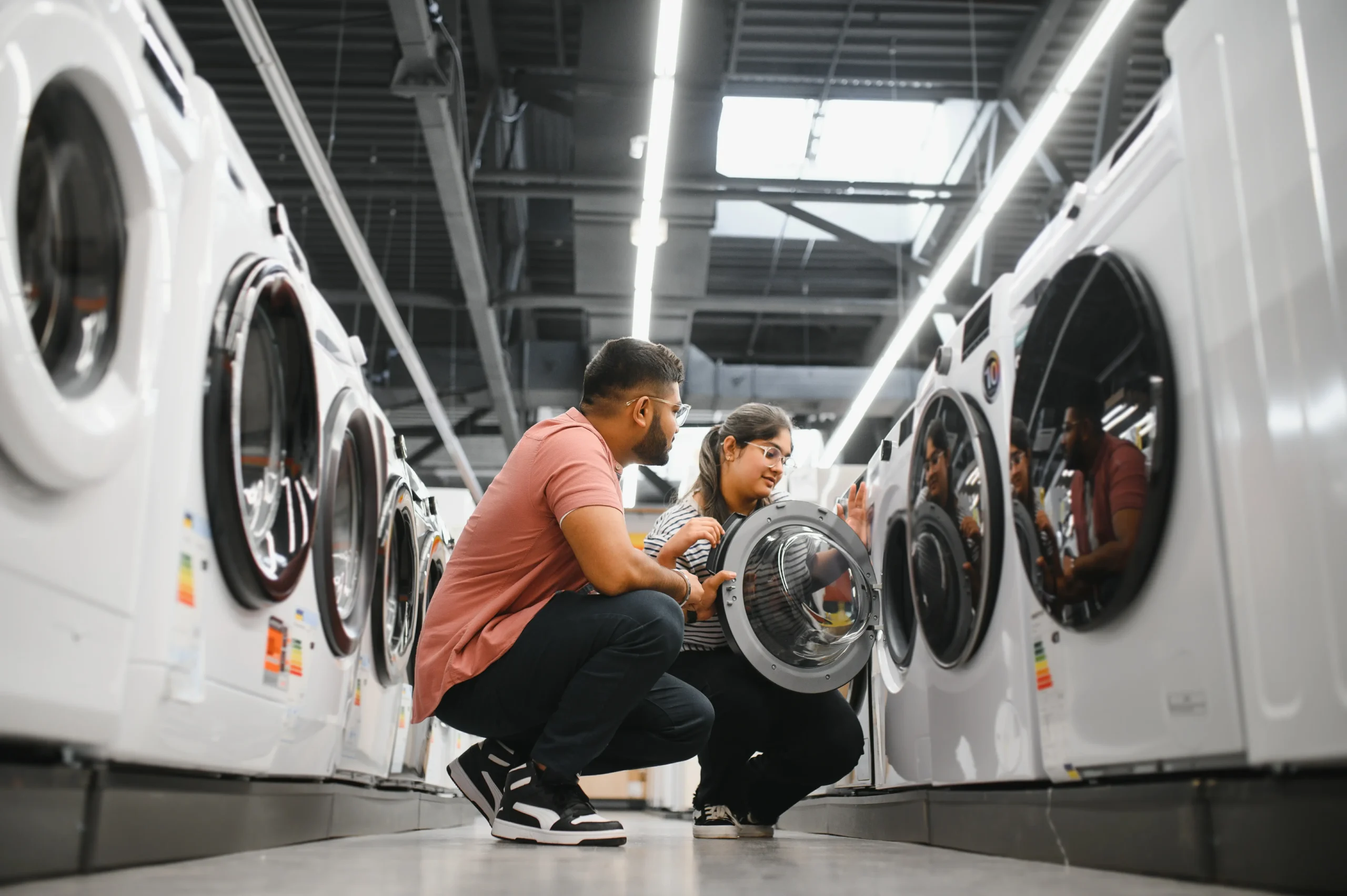 young-multiethnic-couple-explores-home-electronics